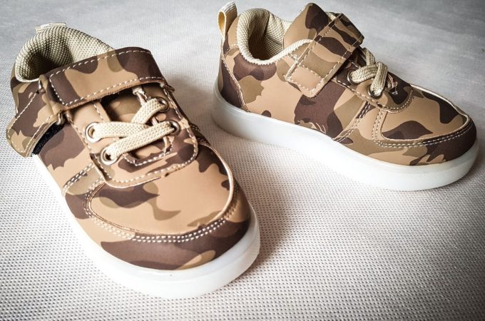 a pair of camouflage shoes